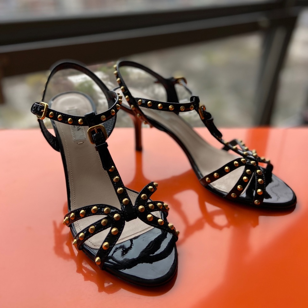 Prada black patent gold stud strappy 3-inch heels.